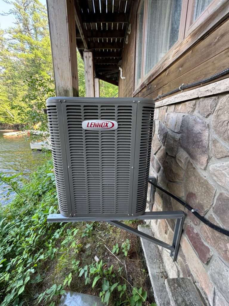 Central air conditioner outside a lakefront Muskoka cottage
