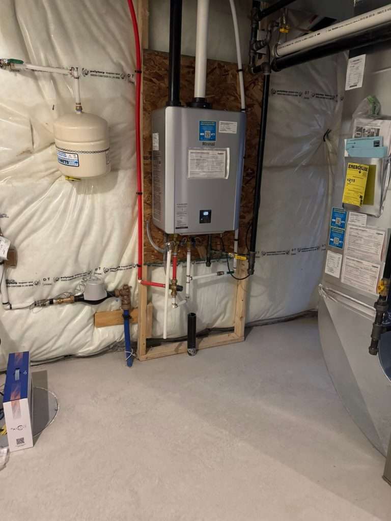 Wall-mounted tankless water heater with new gas and water lines