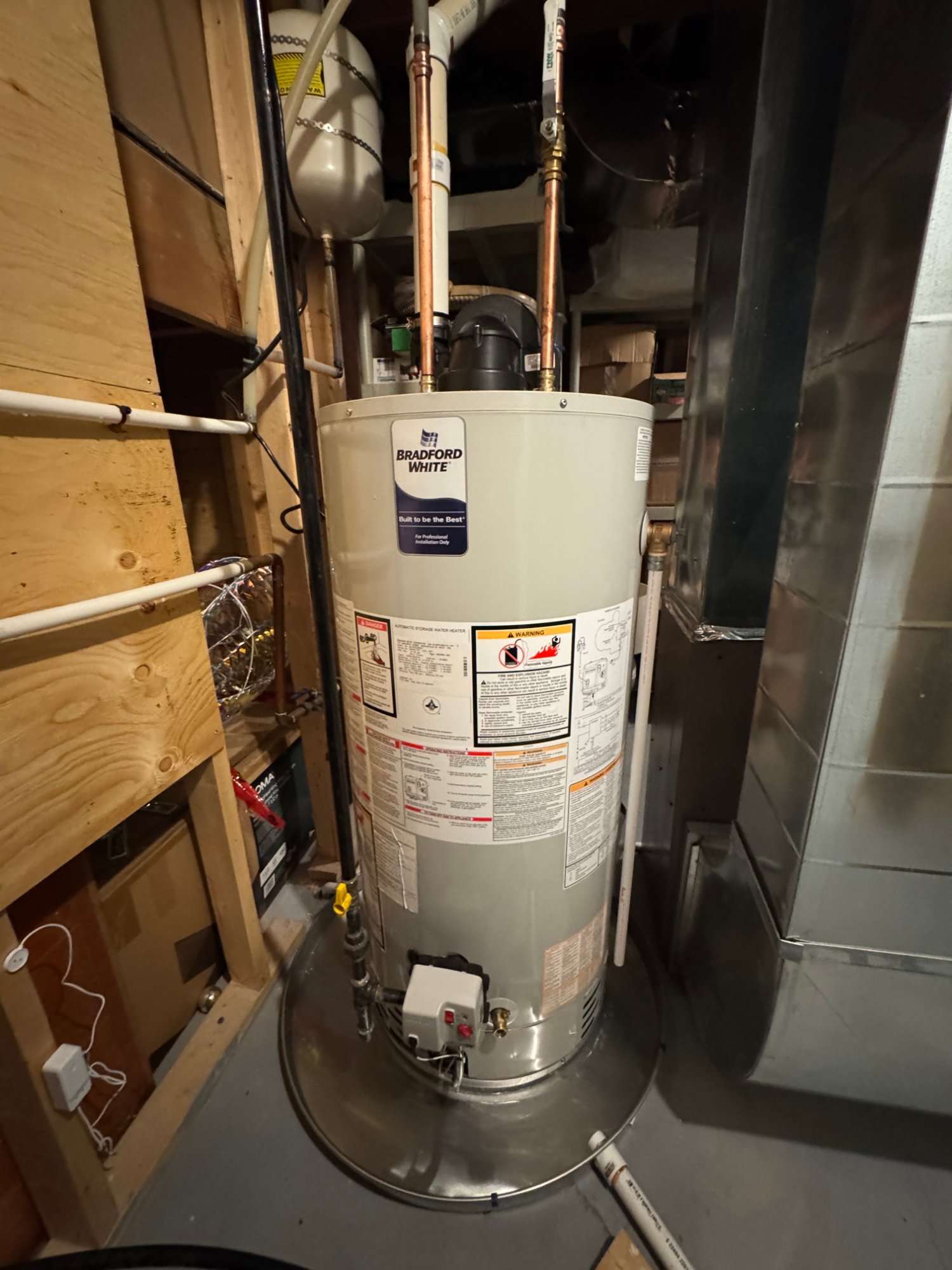 New Bradford White gas water heater installed in a basement